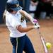 Michigan senior Ashley Lane hits a deep ball and bats in two runs in the game against Louisiana-Lafayette on Saturday, May 25. Daniel Brenner I AnnArbor.com